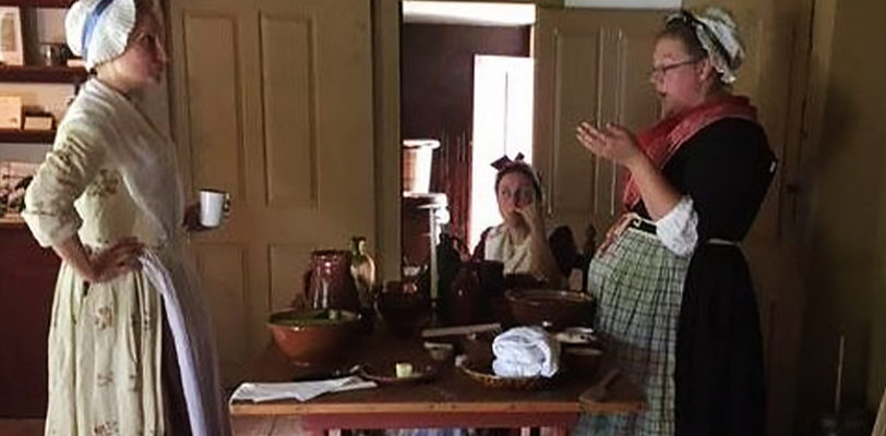 Colonial Women at a table